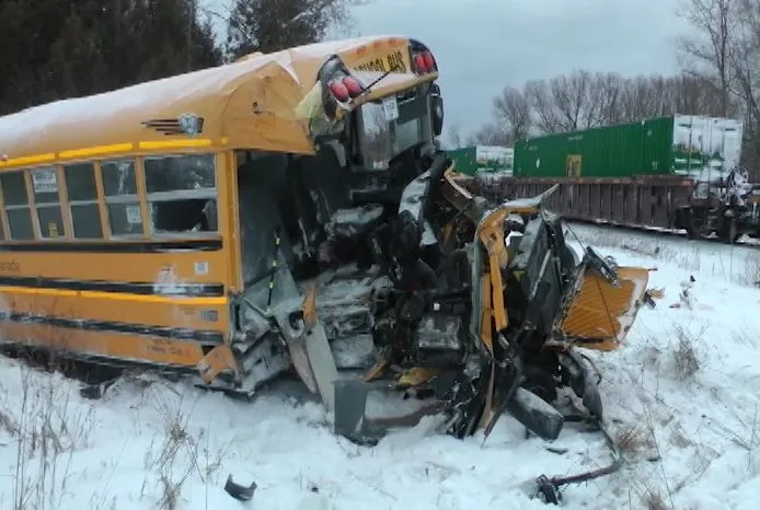 train crashes into school van