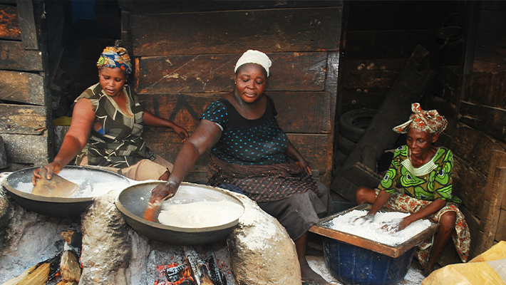 Woman roasting garri