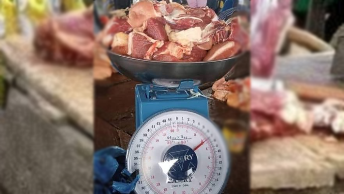 Meat being weighed on a scale