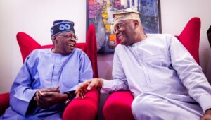 Tinubu sitting with Atiku
