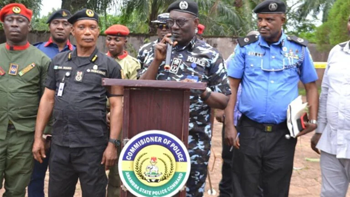 The CP in Anambra, Ikioye Orutugu and other security agencies addressing indigenes of Ogboji community during a meeting on Wednesday ( Credit: NAN )