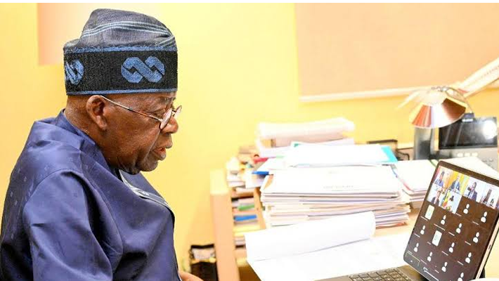 Tinubu on a computer